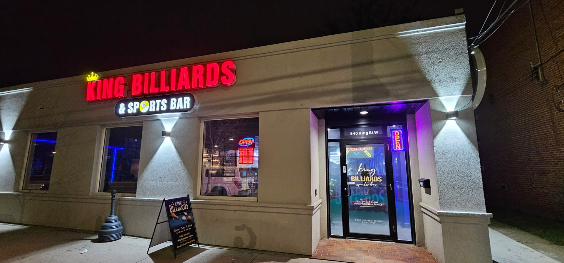 King Billiards & Sports Bar storefront at night on King St W in Westdale